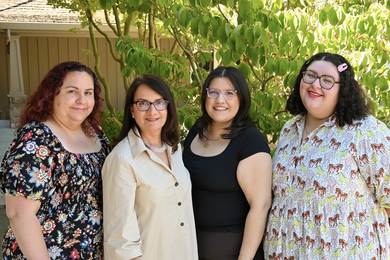 Dr. Fariba Lessani - Founder, O.D. of Alpine Optometry, Naomi Rodriguez, O.D, Rubi Avila-Rapoport, Optician and Wendy Acosta, Front Desk standing together outdoors, smiling in front of a green leafy background - Alpine Optometry | Optometrist Portola Valley Dr. Fariba Lessani - Founder, O.D. of Alpine Optometry, Naomi Rodriguez, O.D, Rubi Avila-Rapoport, Optician and Wendy Acosta, Front Desk standing together outdoors, smiling in front of a green leafy background - Alpine Optometry | Optometrist Portola Valley
